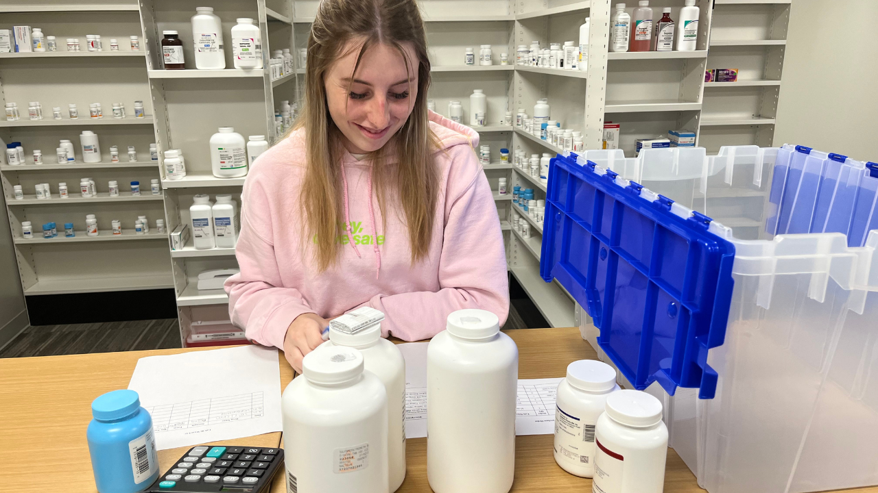 A photo of a pharmacy tech student working