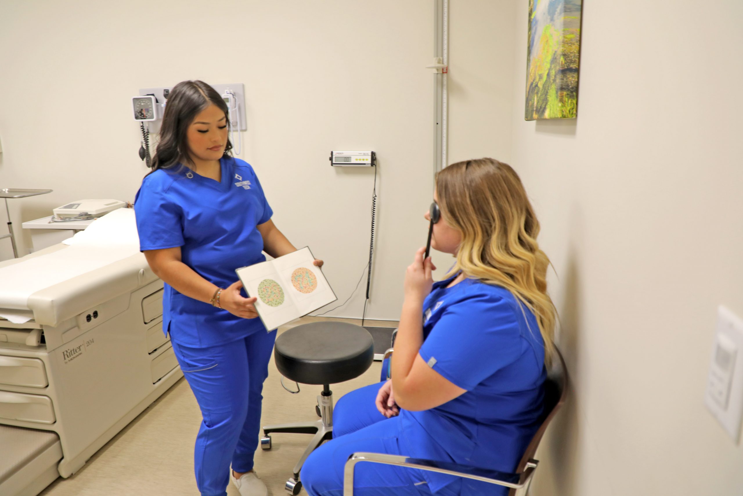 A photo of two STECH medical assistant students working