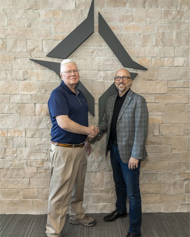 Foundation Board Member Bruce Hughes and Southwest Technical College President Brennan Wood shaking hands.