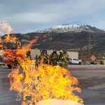 firefighters and a burning barrel.